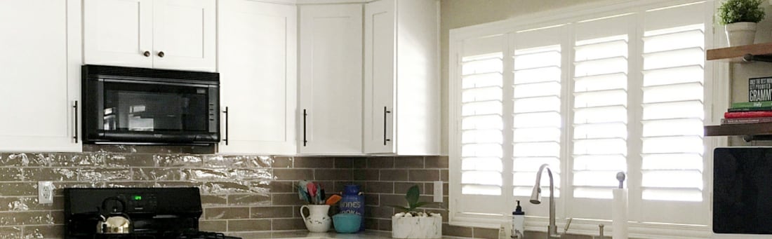Plantation shutters over a sink